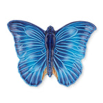 Charola de cerámica en forma de mariposa color azul, de la colección Cloudy de Bordallo Pinheiro