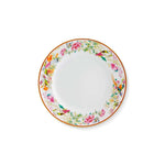 Plato de pan de porcelana blanco con orilla con motivos de flora y fauna de colores y filo de oro, de la colección Paco Real de Vista Alegre