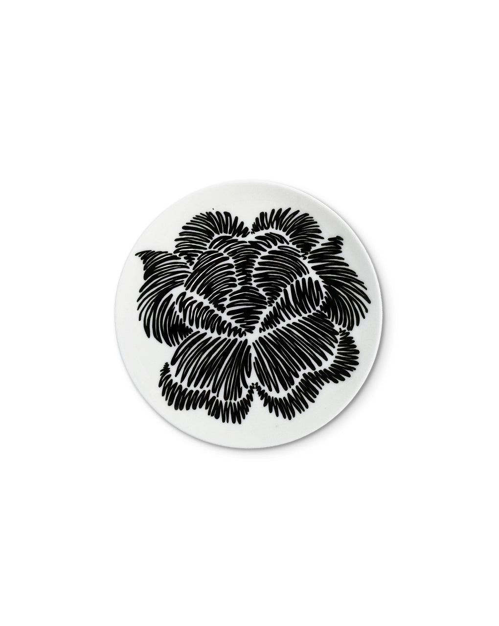 Plato de pan con flor negra de la colección Identidad diseñada por Sofía Aspe Interiorismo para Zash