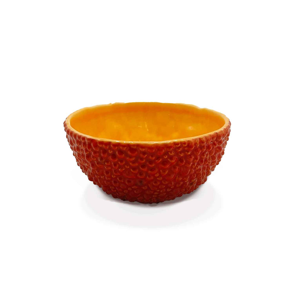 Bowl de cerámica con textura imitación cáscara de fruta tropical en color rojo, marca Bordallo Pinheiro