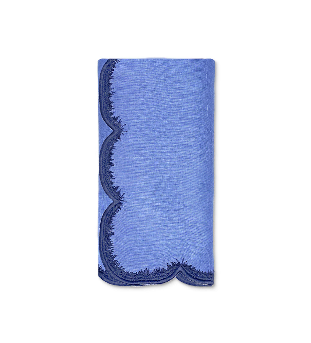 Servilleta de lino azul con bordado de pelitos. marca Zash