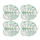 Servilletas cocteleras en forma de hoja monstera en color arena con orilla bordada verde, marca Zash