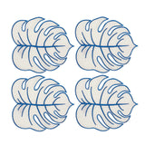 Set con 4 servilletas cocteleras Tropic de lino arena en forma de hoja monstera con orilla bordada en azul, marca Zash