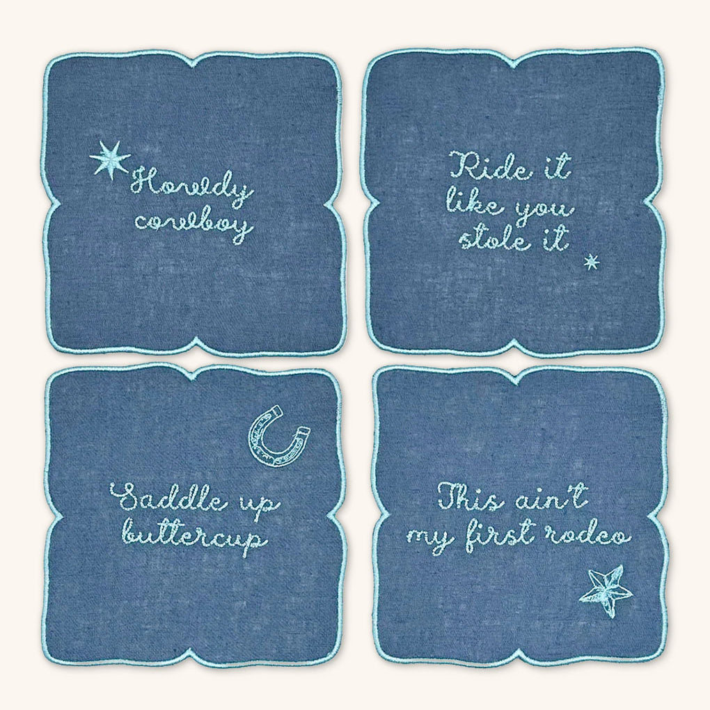 Cocteleras con Frases Vaqueras en Lino Azul con Bordado Turquesa. Set de 4