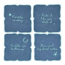 Servilletas cocteleras en lino azul rey con frases vaqueras bordadas en azul turquesa, marca Zash