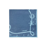 Servilleta Cowgirl en lino azul con motivos vaqueros bordados en azul turquesa, diseñados por Dan Cassab para Zash
