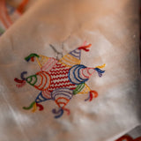 Servilletas Posada en Lino Blanco con Bordado de Piñata de Colores. Set de 4