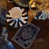 Set de Manteleria Talisman con Individuales, Servilletas, Servilleteros y Cocteleras en Lino Azul Marino con Bordado en Plateado