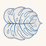 Individual Tropic de Hoja en Lino Arena con Orilla Bordada en Azul. Set de 4