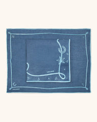 Mantelería Cowgirl con Individuales y Servilletas en Lino Azul con Bordado Teal. Set para 4 personas.