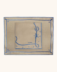 Mantelería Cowgirl con Individuales y Servilletas en Lino Caramelo con Bordado Azul. Set para 4 personas.