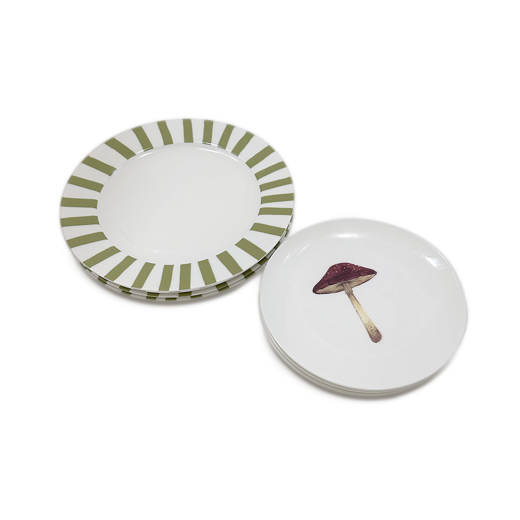 Set de vajilla con platos trinche candy cane con rayas gruesas verde olivo, y platos de ensalada con ilustración de hongo. Marca Zash