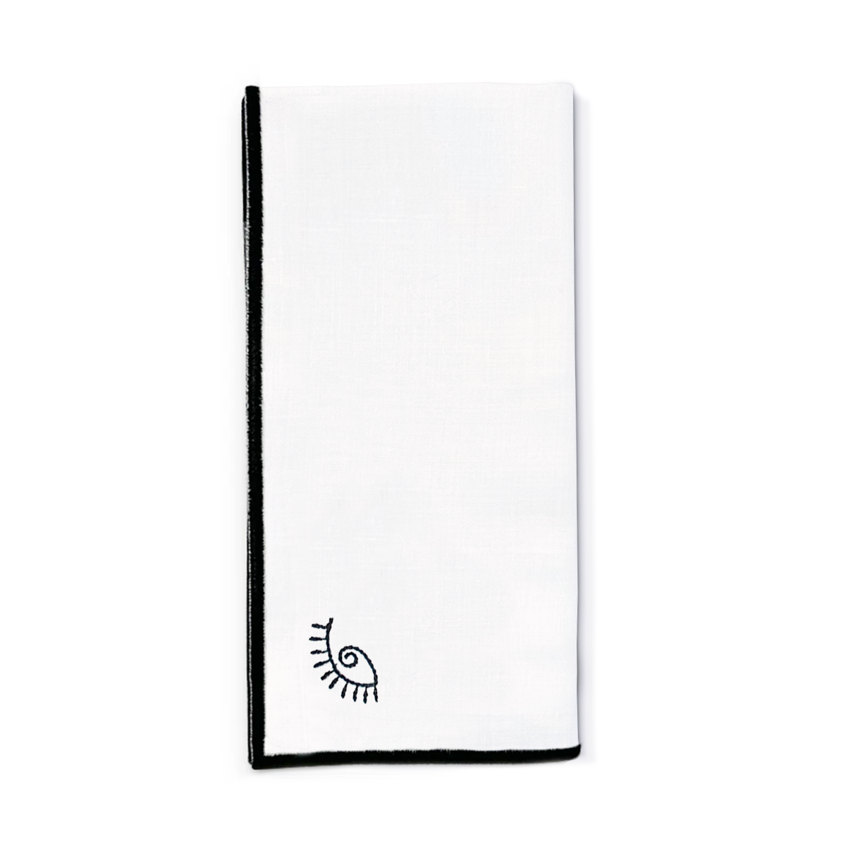 Servilleta de lino blanco con ojo de la suerte y orilla bordada en negro, marca Zash