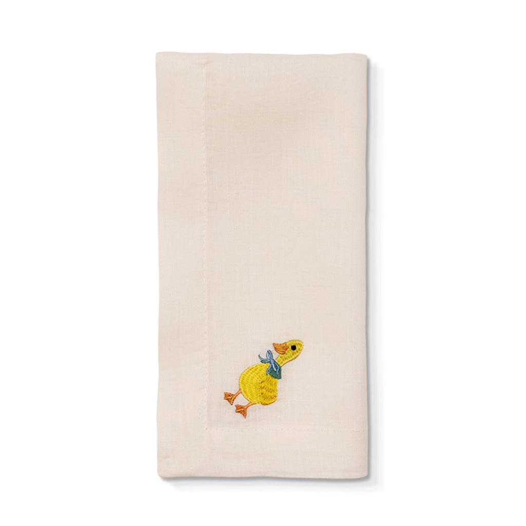 Servilleta de Lino Ivory con bordado de patito con moño, marca Zash