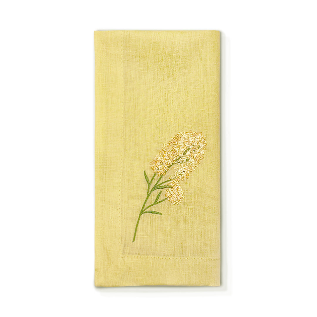 Servilleta de lino en color amarilla con bordado de flor amarilla, marca Zash