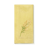 Servilleta de lino en color amarilla con bordado de flor amarilla, marca Zash