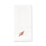 Servilleta de lino blanco con bordado de caracol de mar en rosa, marca Zash