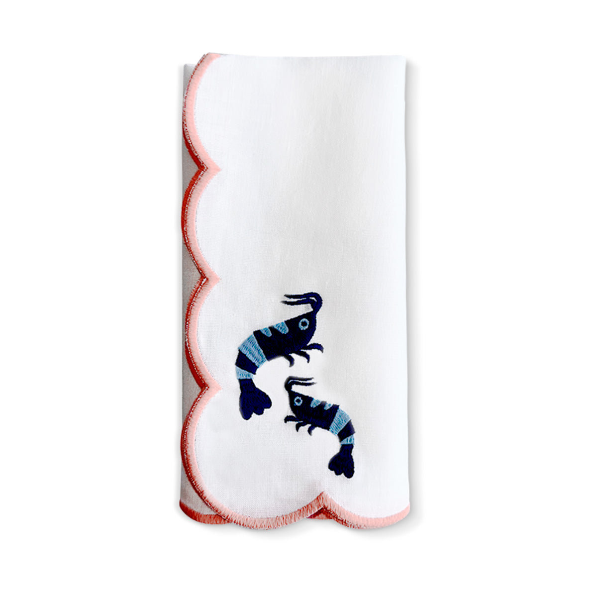 Servilleta de lino blanca con camarones bordados en azul, y orilla bordada en rosa. Marca Zash