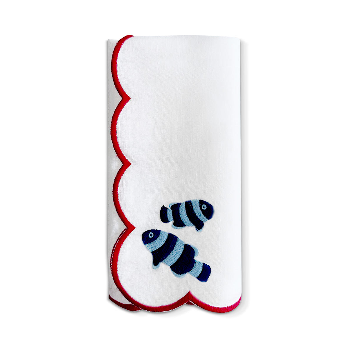 Servilleta de lino blanco con bordado de peces payaso y orilla bordada en hilo rojo, marca Zash