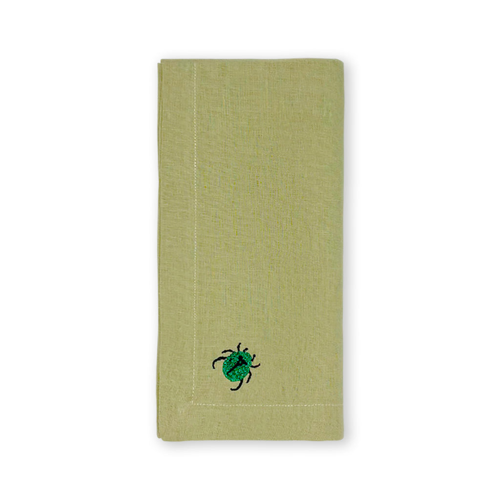 Servilleta en lino verde seco olivo con bordado de insecto bicho de la marca Zash