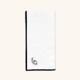 Servilleta de Lino con Orilla en Negro y Ojo Bordado