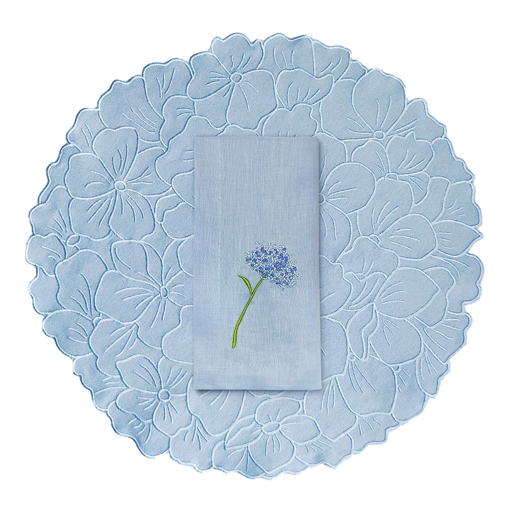 Set de mantelería de flor azul con individuales y servilletas, marca Zash