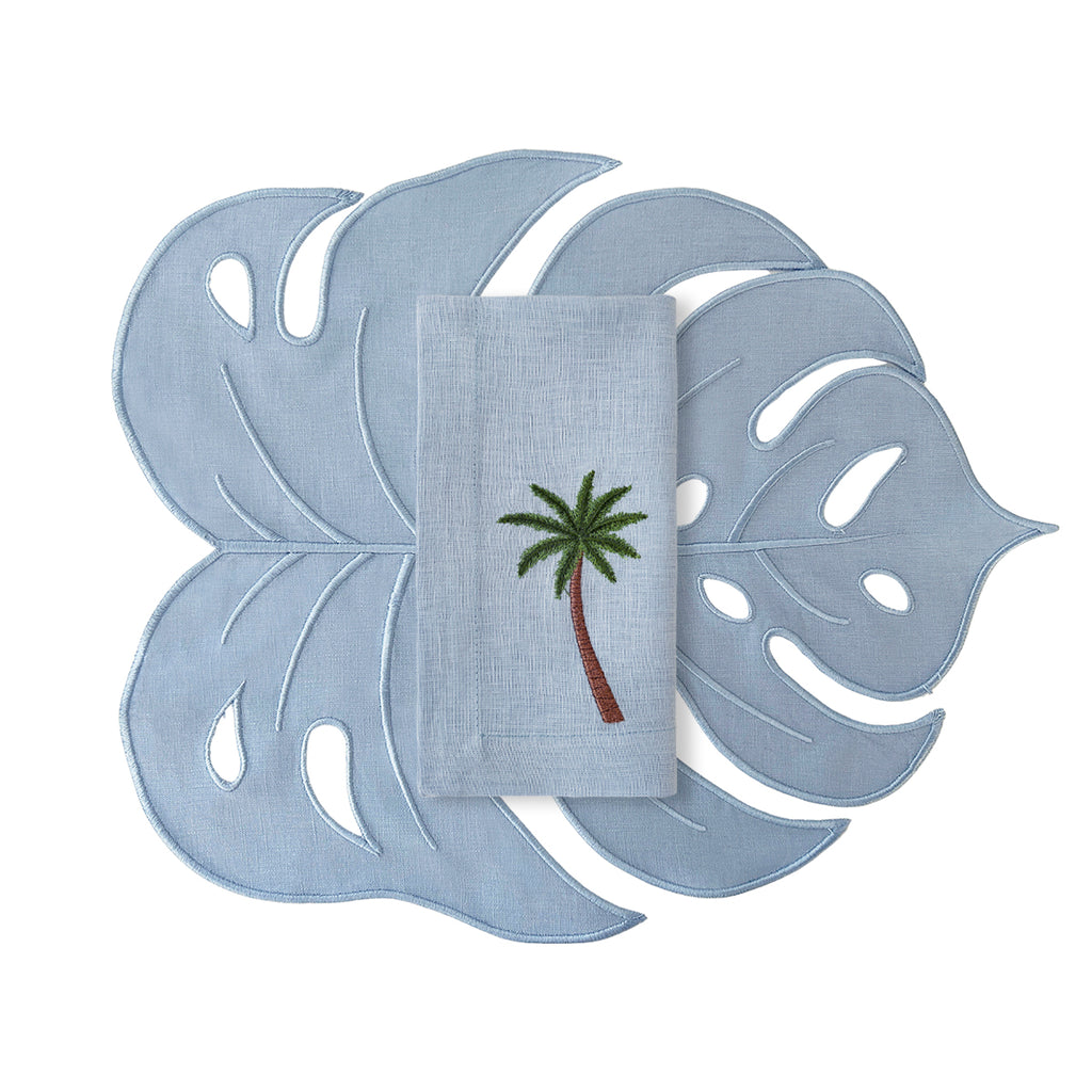 Set de mantelería con individuales en forma de Hoja Monstera Azul con servilletas de lino con Palmera bordada, marca Zash