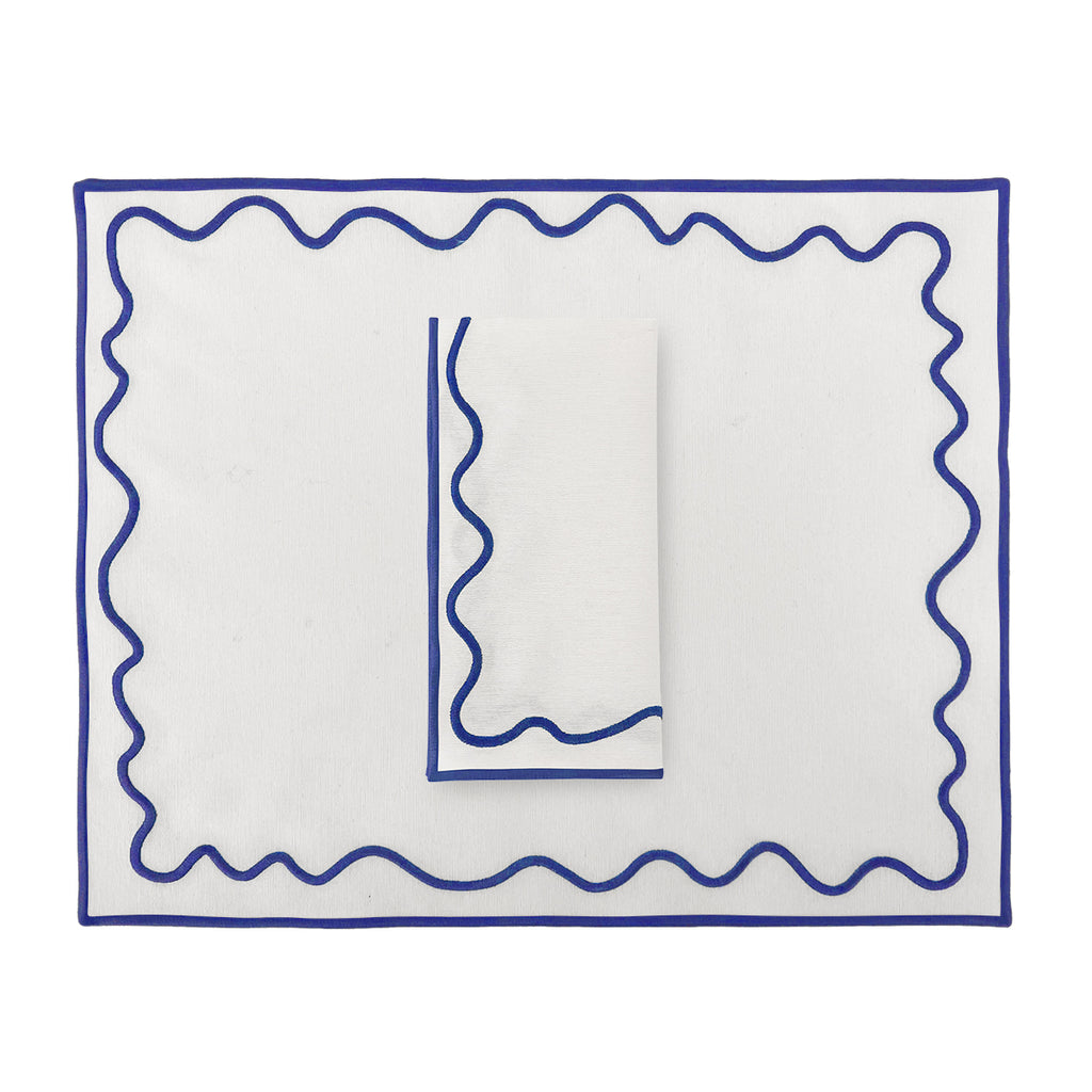Set mantel individual con servilleta blanco con bordado en ondas azul, marca Zash