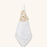 Set de Mantelería Talismán con Servilletero en Lino Blanco con Bordado Dorado y Servilleta Jimmy Ivory