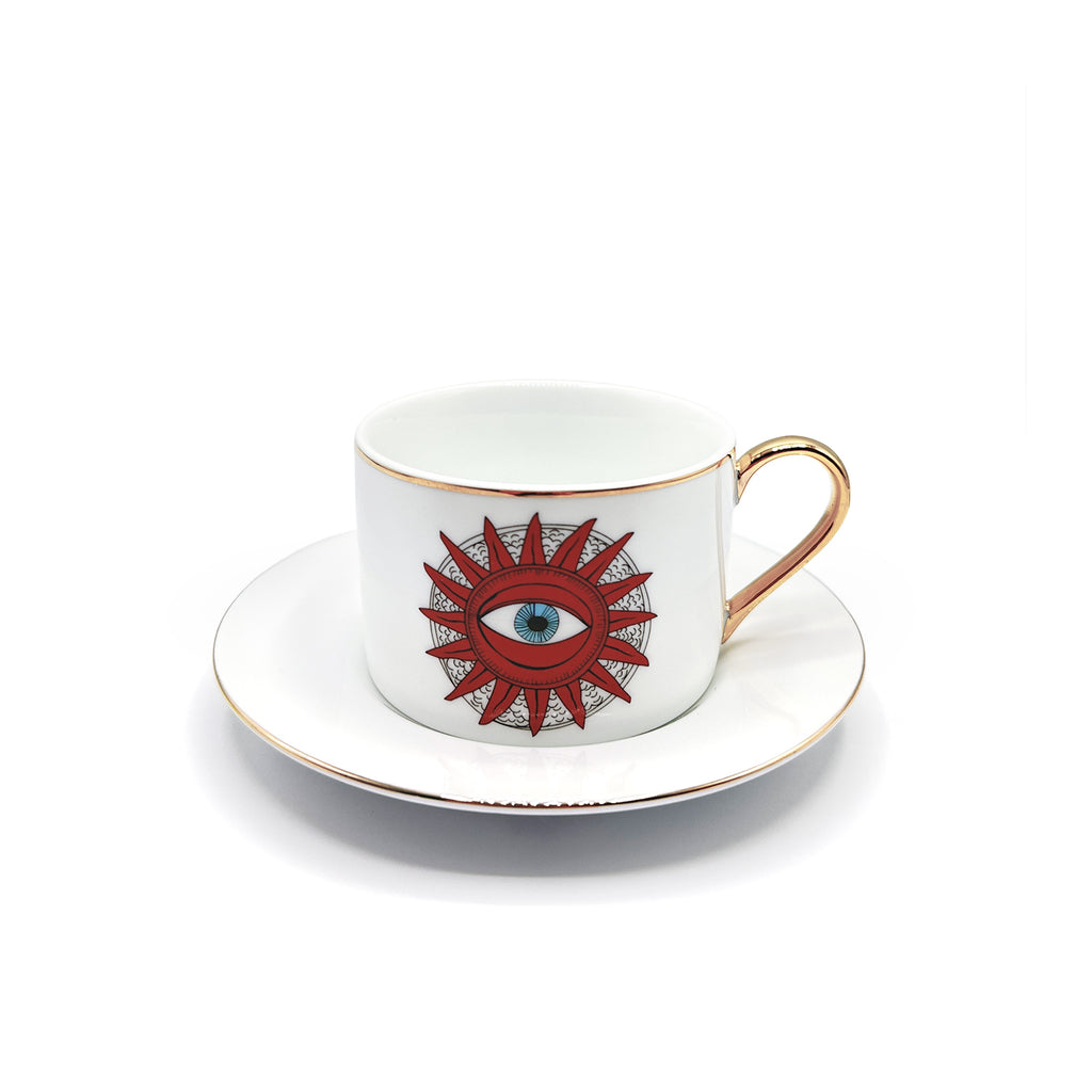 Taza con platito de porcelana para Té con ojo místico dentro de un sol,  borde dorado