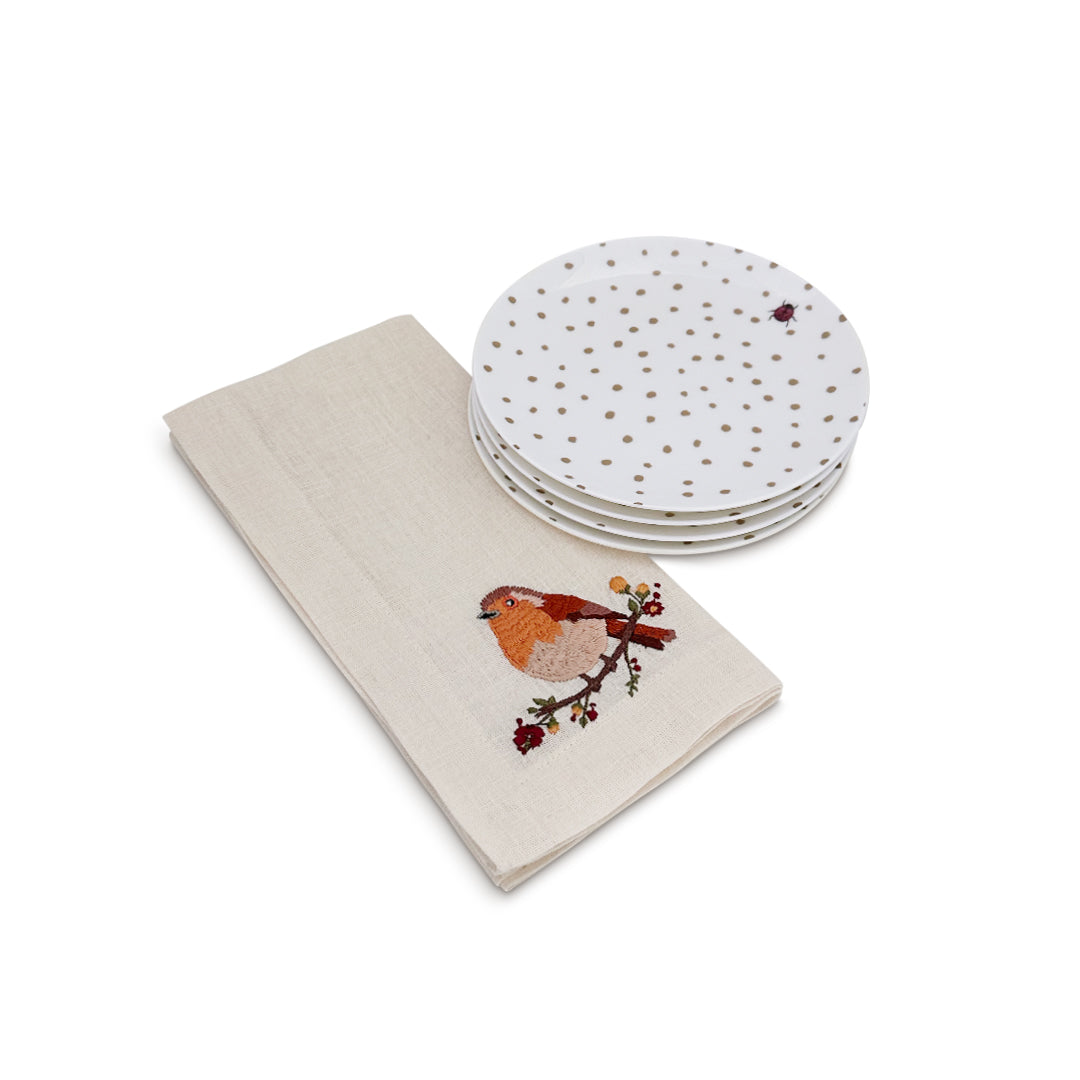 Set con platitos de pan con catarina y servilletas de lino crudo con pajarito otoñal bordado